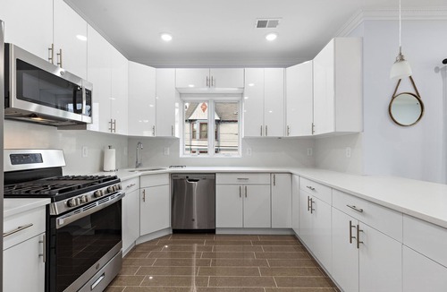 McGinley Square Apartment | Massive 4-bedroom, 3-bathroom apartment with shared yard & bonus garage parking