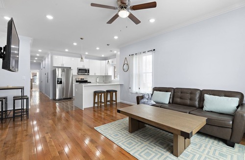 McGinley Square Apartment | Massive 4-bedroom, 3-bathroom apartment with shared yard & bonus garage parking