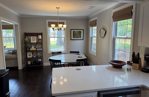 Pendleton King House | Masters rental with spacious back porch, fenced in yard, and park frontage.