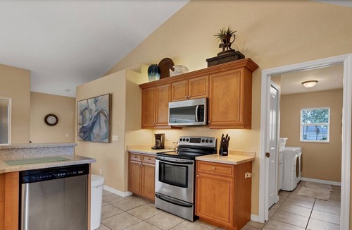 White Marsh House | Medalist - Stunning lake side home with pool