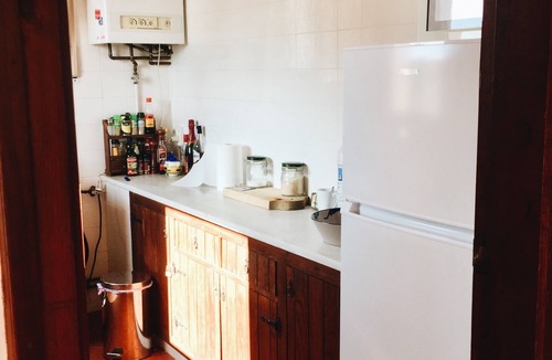 Sant Feliu de Guixols Apartment | Mediterranean apartment in a rustic style.
