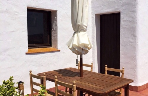 Sant Feliu de Guixols Apartment | Mediterranean apartment in a rustic style.