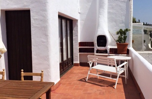 Sant Feliu de Guixols Apartment | Mediterranean apartment in a rustic style.