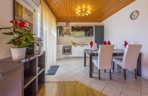 Povile Apartment | Mediterranean flat just 470 metres from the beach with sea view, baby cot, barbecue