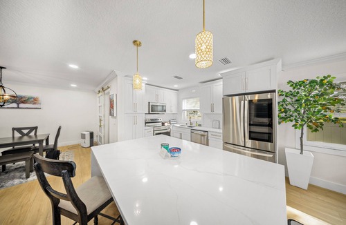 Carrollwood House | Mediterranean Oasis! Pool, Putt Putt, & Grill!