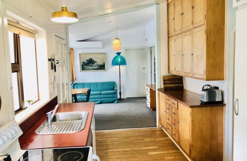 Castlecliff House | Mid-Century Beach Front Bach with beach access 2 doors down and superb views