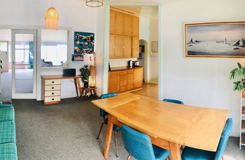 Castlecliff House | Mid-Century Beach Front Bach with beach access 2 doors down and superb views