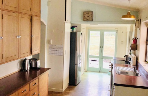 Castlecliff House | Mid-Century Beach Front Bach with beach access 2 doors down and superb views