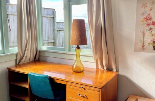 Castlecliff House | Mid-Century Beach Front Bach with beach access 2 doors down and superb views