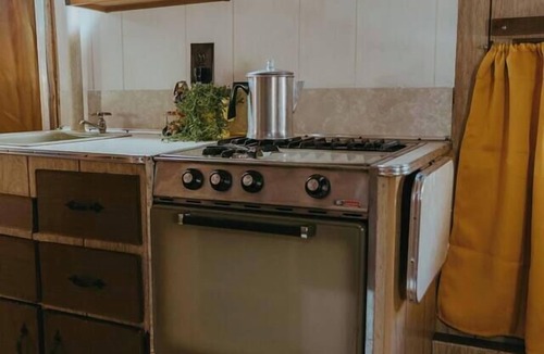 Wichita House | Mid-Century Charmer: Hot Tub, Stocktank Pool, Firepit, & Vintage Camper