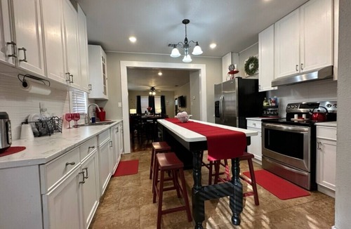 Harlandale House | Midnight Lantern Riverwalk ⛳️ . Golf nearby,Cornhole, Lifesize Checkers,Foosball
