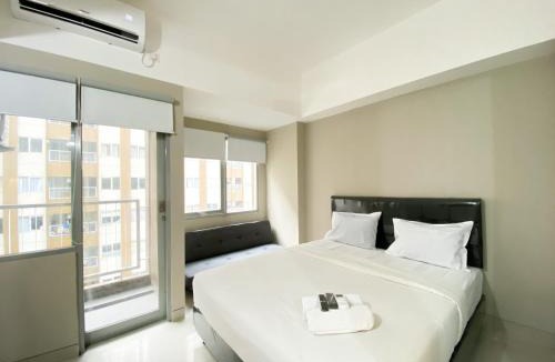 Duren Sawit Apartment | Minimalist Studio Room Gateway Park LRT City Jatibening Apartment By Travelio