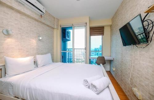 Kayu Putih Apartment | Minimalist Studio with Great City View at Tifolia Apartment By Travelio