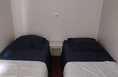 Bussiere-Poitevine House | Mobile home facing a pond