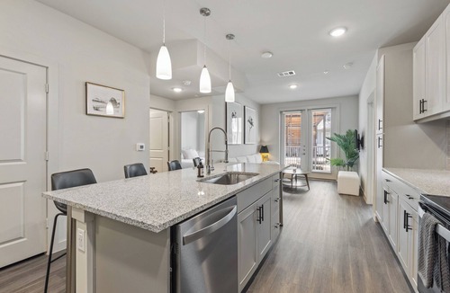 Windsor Park Apartment | Modern 2BR Poolside Patio Suite in North Austin