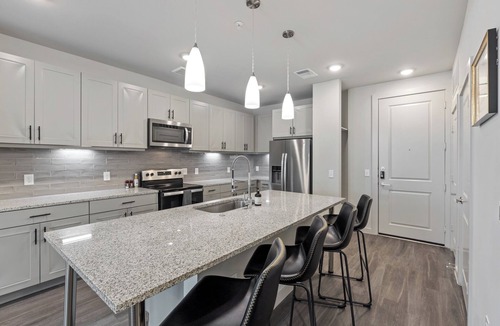 Windsor Park Apartment | Modern 2BR Poolside Patio Suite in North Austin