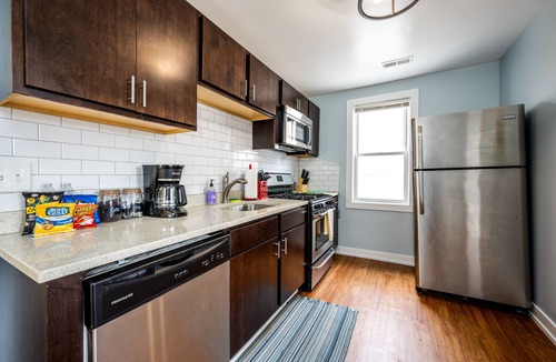 Logan Square Apartment | Modern 3-Bed Stay w/Patio, Firepit, & Garage Parking Spot