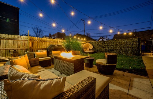 Logan Square Apartment | Modern 3-Bed Stay w/Patio, Firepit, & Garage Parking Spot