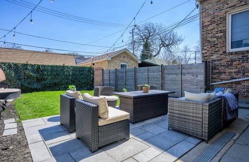 Logan Square Apartment | Modern 3-Bed Stay w/Patio, Firepit, & Garage Parking Spot