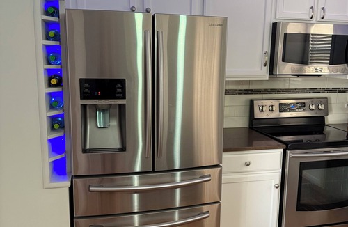 Dubuque House | Modern 3-bedroom, 3 full bath, 2 living areas, 2 kitchens, game room, hot tub!