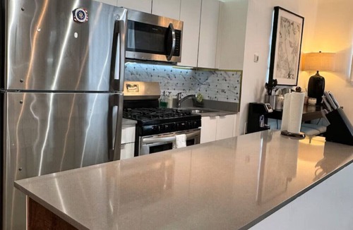 East Harlem Apartment | Modern 3BR Fireplace Gym Lounge