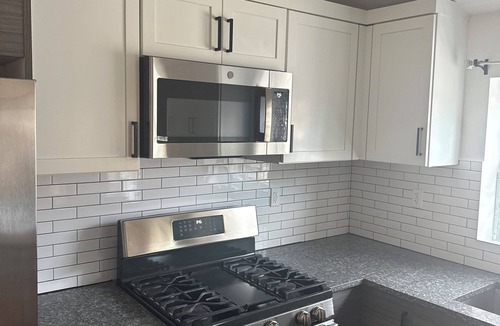 Queens House | Modern 4-bedroom townhome in lovely Jamaica with cool AC