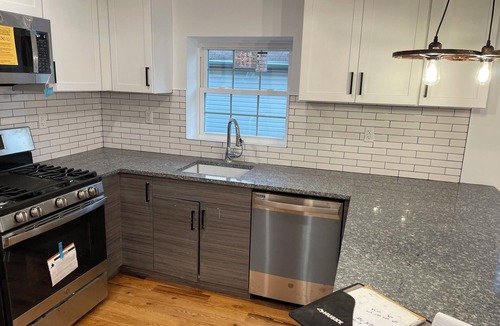 Queens House | Modern 4-bedroom townhome in lovely Jamaica with cool AC