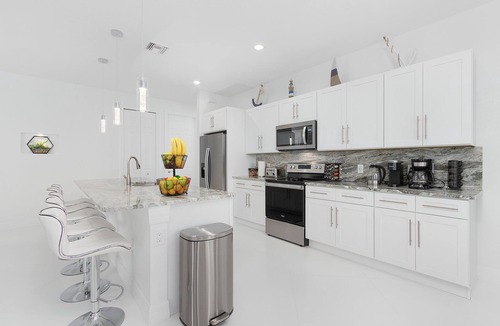 Trafalgar House | Modern 4BD/3BH Waterfront Home with Heated Pool and Golf Access and EV Charger