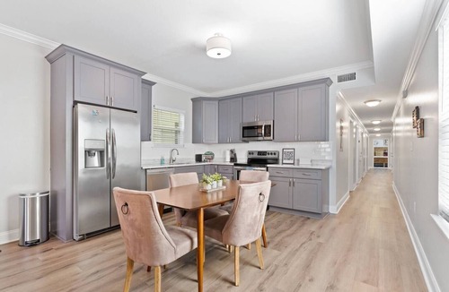 Tulane - Gravier Apartment | Modern 4BR Mid-City home with heated pool & parking. Steps to streetcar, near FQ & parades.