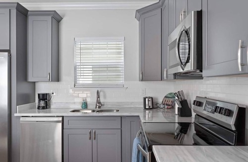 Tulane - Gravier Apartment | Modern 4BR Mid-City home with heated pool & parking. Steps to streetcar, near FQ & parades.