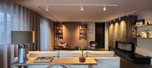 Flims Apartment | Modern Alpine Retreat Garden and Panoramic Views