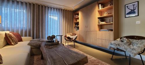 Flims Apartment | Modern Alpine Retreat Garden and Panoramic Views
