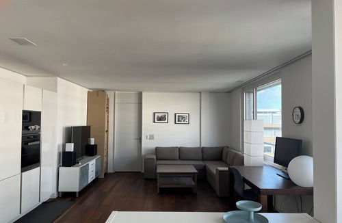 Escher Wyss Apartment | Modern and bright home by Prime Tower with workspaces & balcony
