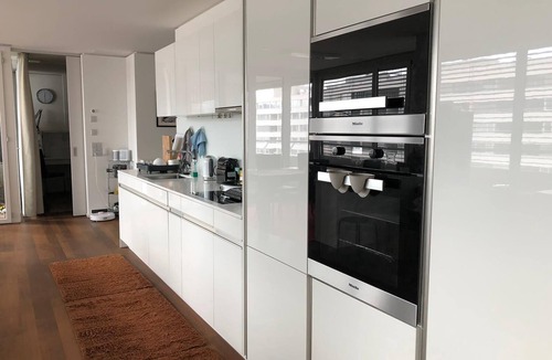 Escher Wyss Apartment | Modern and bright home by Prime Tower with workspaces & balcony