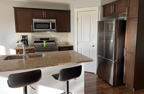 Cochrane Apartment | Modern and chic, fully equipped chef inspired kitchen!