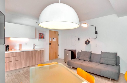 West Avenue Condo | Modern Boutique W/Balcony, Roof Pool & Terrace II