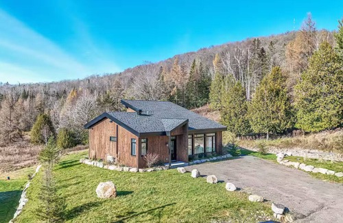 Wentworth-Nord Ski Chalet | Modern elegance and cozy charm! Our Chalet Aura offers tranquil landscape views.