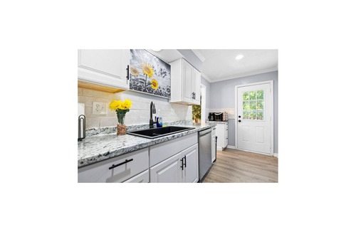 Olathe Apartment | Modern Family Gateway 2-connected duplexes by YDSH GuestMind! Guests enjoy full private access, easy self check in, and dedicated parking.