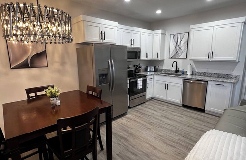 Joplin House | Modern Family Getaway! Heated Pool, Hot tub Theatre Room, Game room!