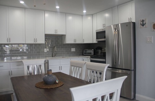 Village Green House | Modern Getaway within walking distance to the harbor!