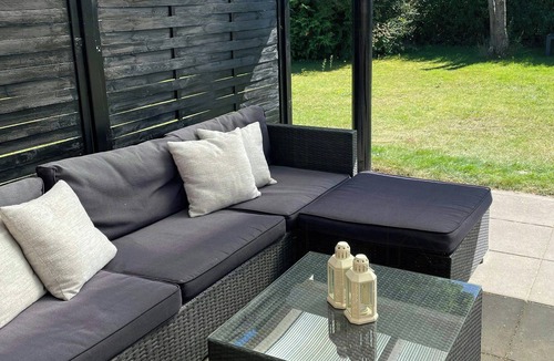 Grena Strand House | Modern holiday home with spa at Grenaa Beach