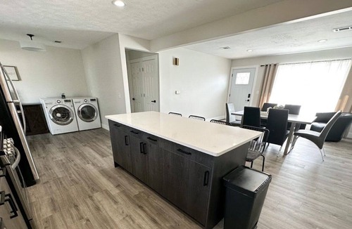 Lincoln House | Modern Home near downtown and UNL with Firepit, BBQ Grill & Air Hockey!