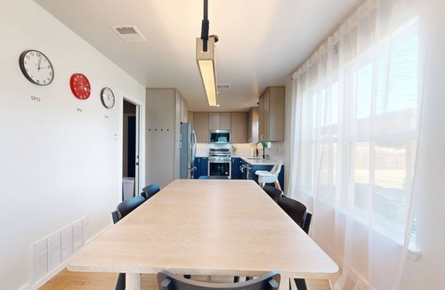 Scofield Farms House | Modern home with an enclosed backyard with wood fire pit in North Austin