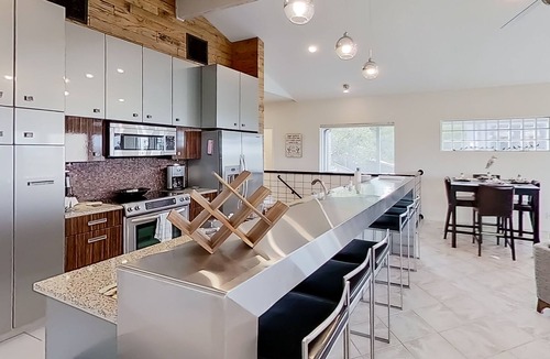 Lago Vista House | Modern lake-view retreat with balcony, deck, Peloton, central AC, & washer/dryer