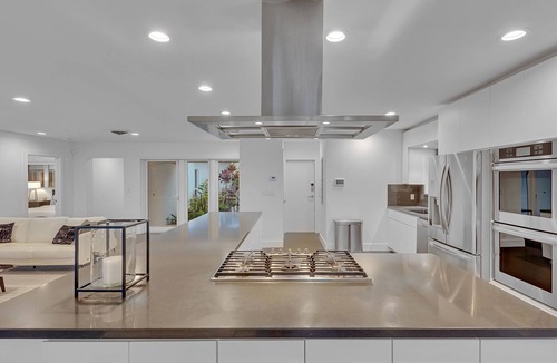 Central Corals House | Modern Lakeside Pool Home with Abundant Space