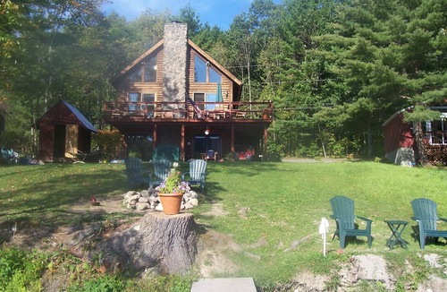 Wells Ski Chalet | Modern Log Home with 70 feet of lakefront! Great Fishing and Swimming!