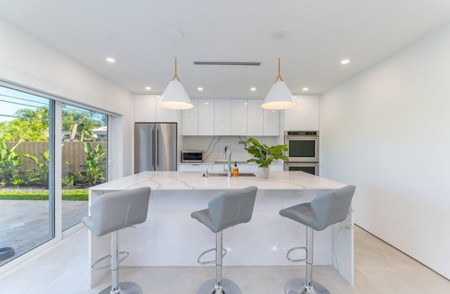 Imperial Point House | Modern Oasis, Heated Pool, Short Drive to Beach