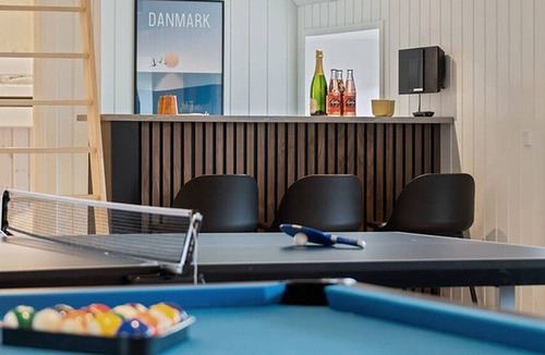 Klegod Strand House | Modernly equipped holiday home with activity room, pool, whirlpool and sauna