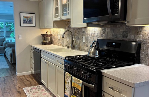 Pentwater Cottage | MONTHLY RENTAL. Charming, updated cottage in Pentwater with AC, deck & hot tub.