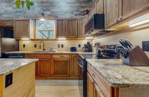 Webster House | Mountain view home with a large patio and private hot tub | fire-pit | gas grill